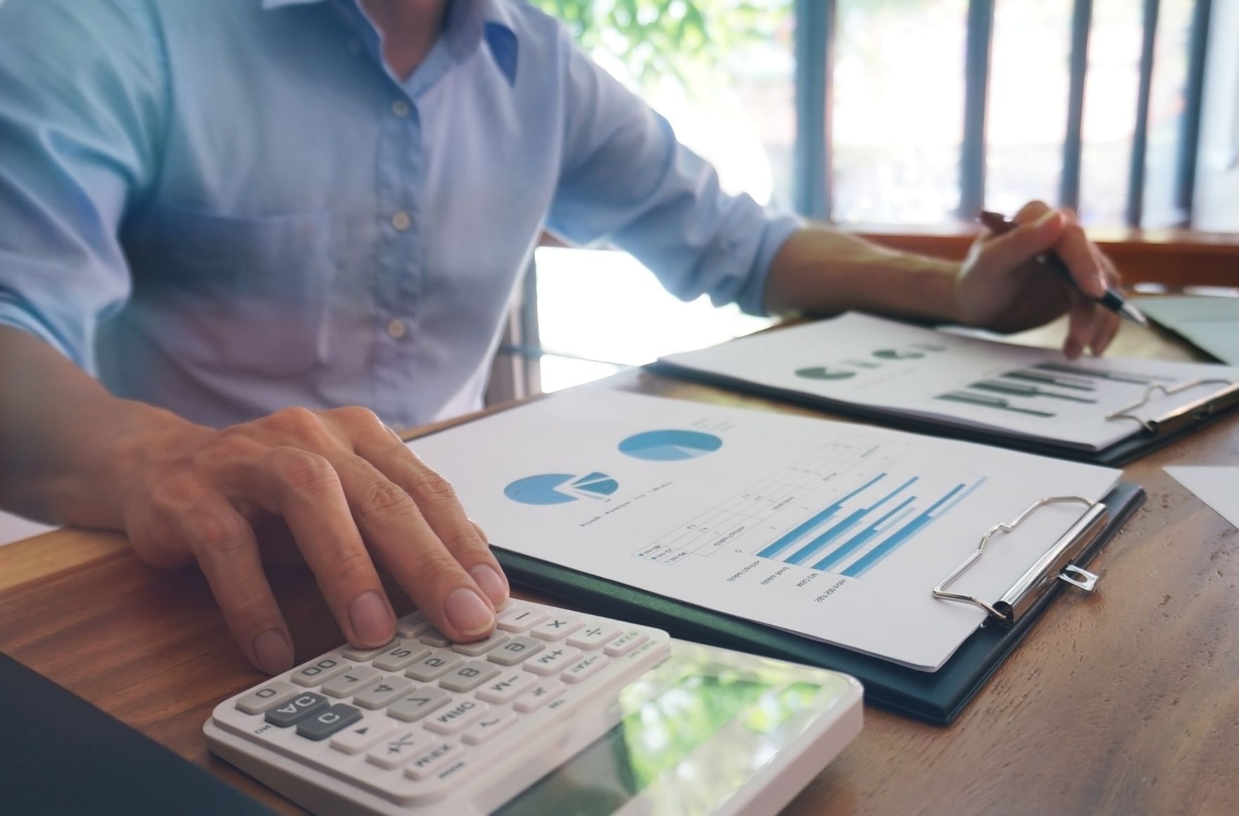 Accountant at work with calculator